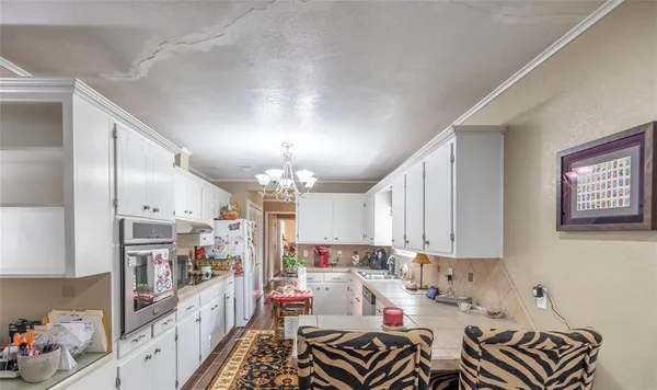 a view of kitchen and dining area with furniture
