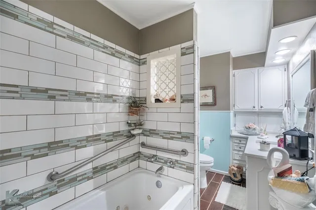a bathroom with a bathtub and sink