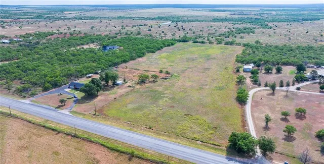 an aerial view of beach with residential space and ocean view