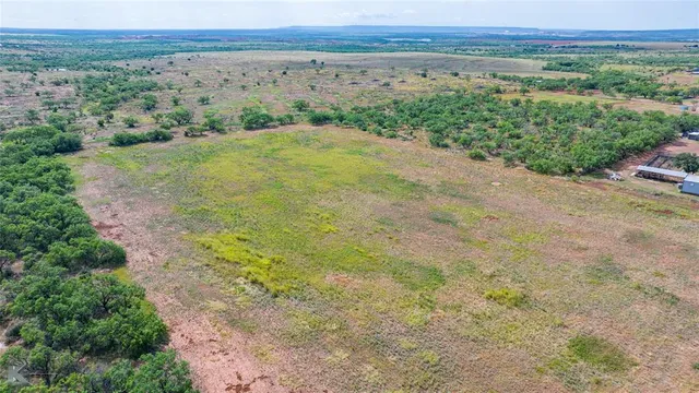 an aerial view of mountain with trees