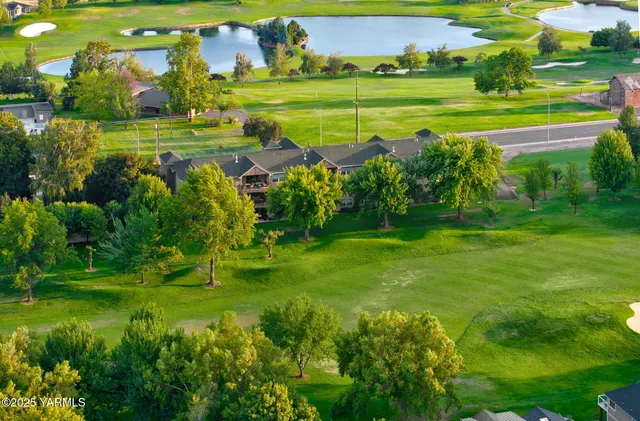 a view of a golf course with a lake view