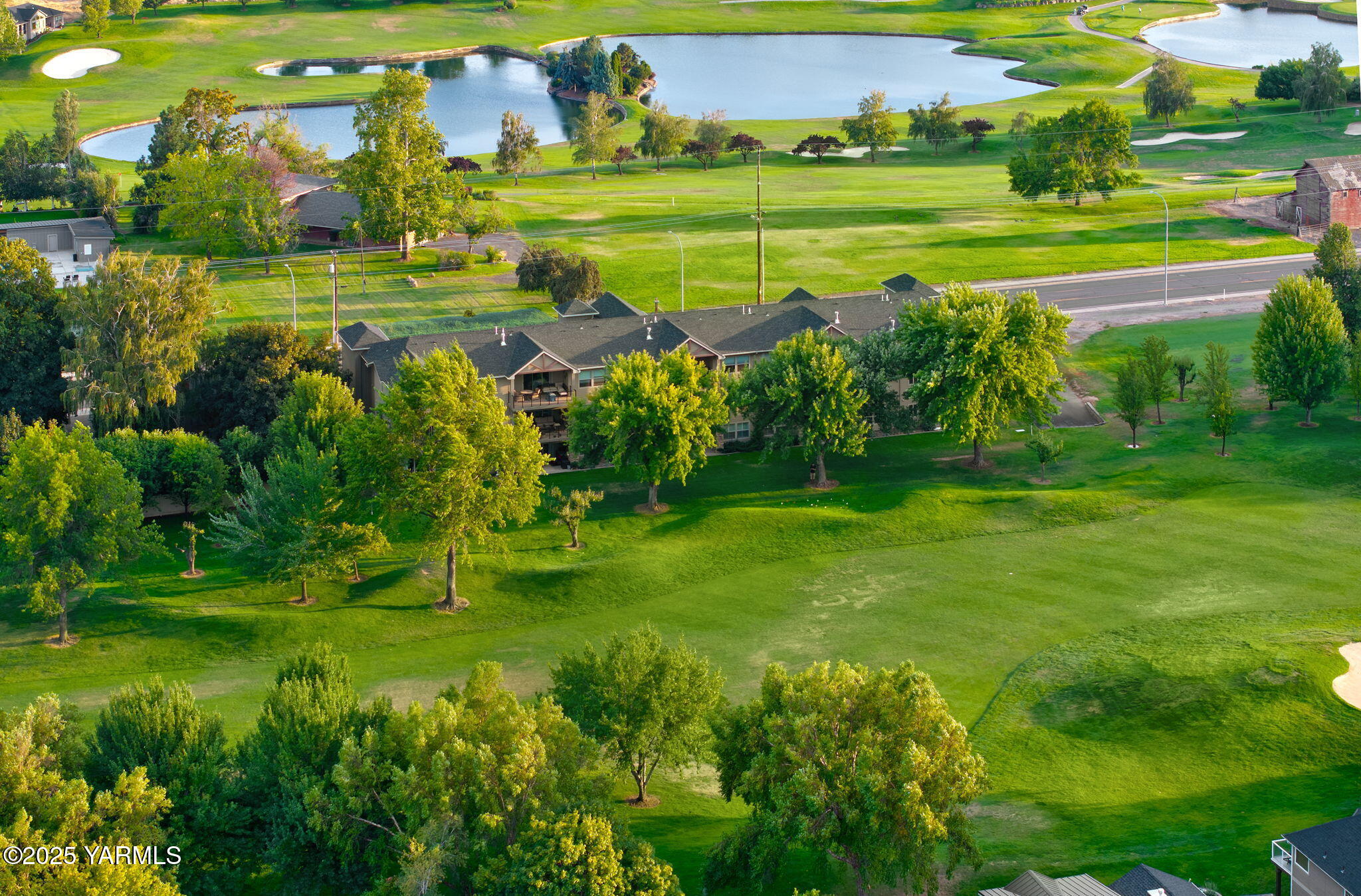 8905 Occidental Road, Unit 301A Yakima, WA 98903 - Photo 11 of 24 a view of a golf course with a lake view