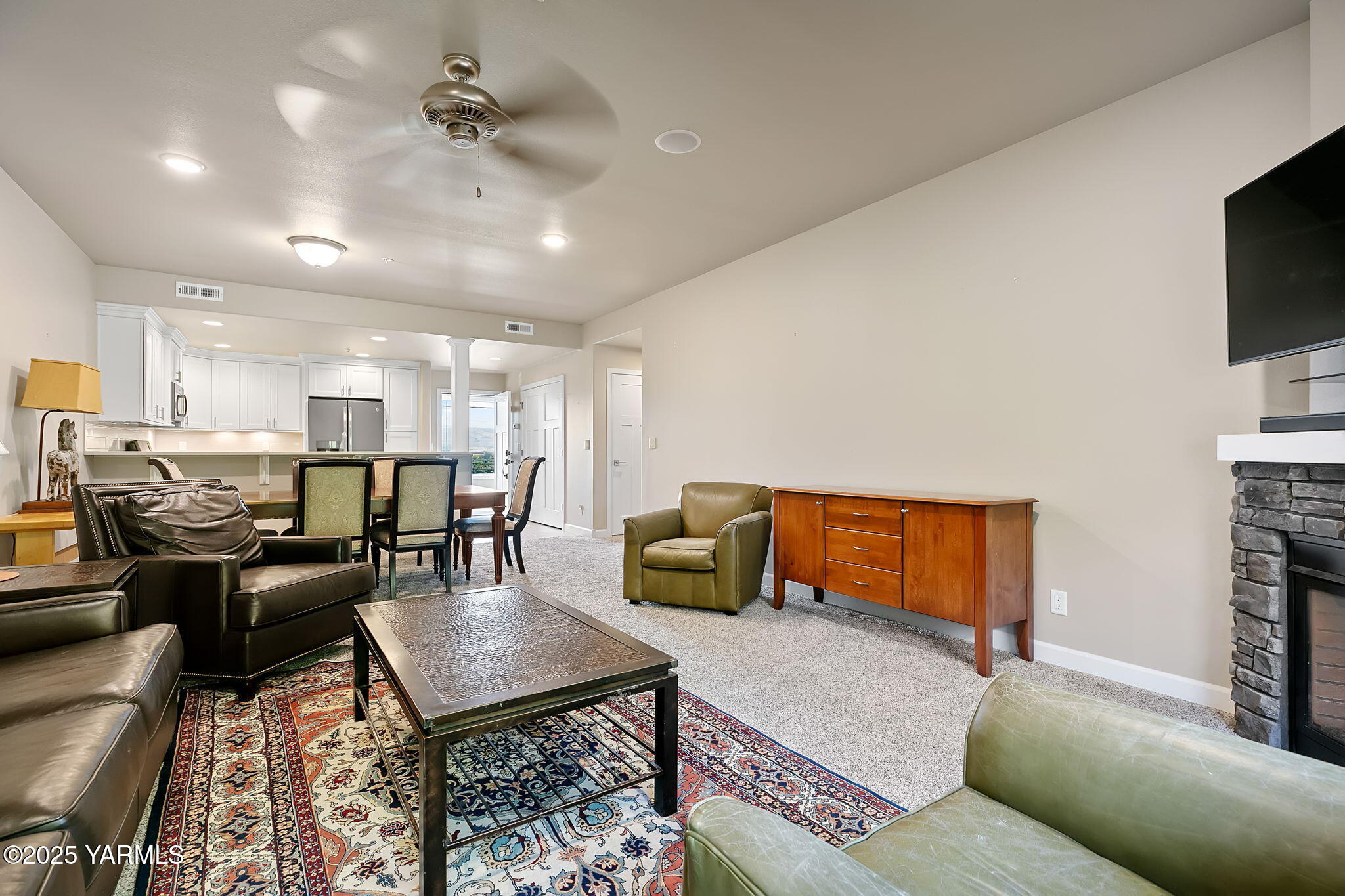 8905 Occidental Road, Unit 301A Yakima, WA 98903 - Photo 13 of 24 a living room with furniture and a flat screen tv
