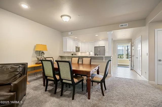 a dining room with furniture and window