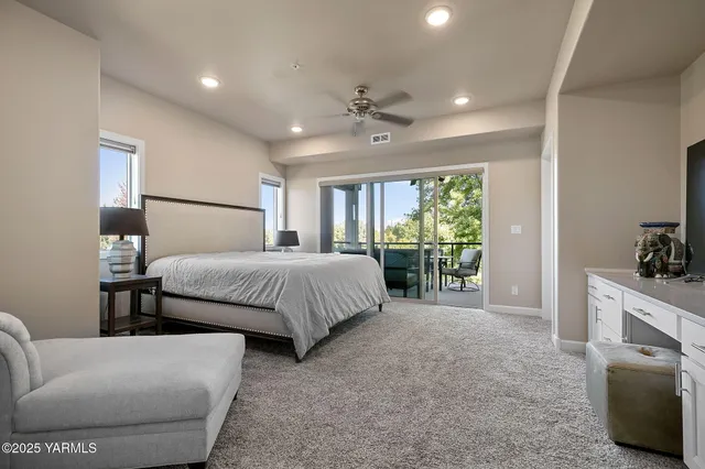 a bedroom with furniture and a fireplace