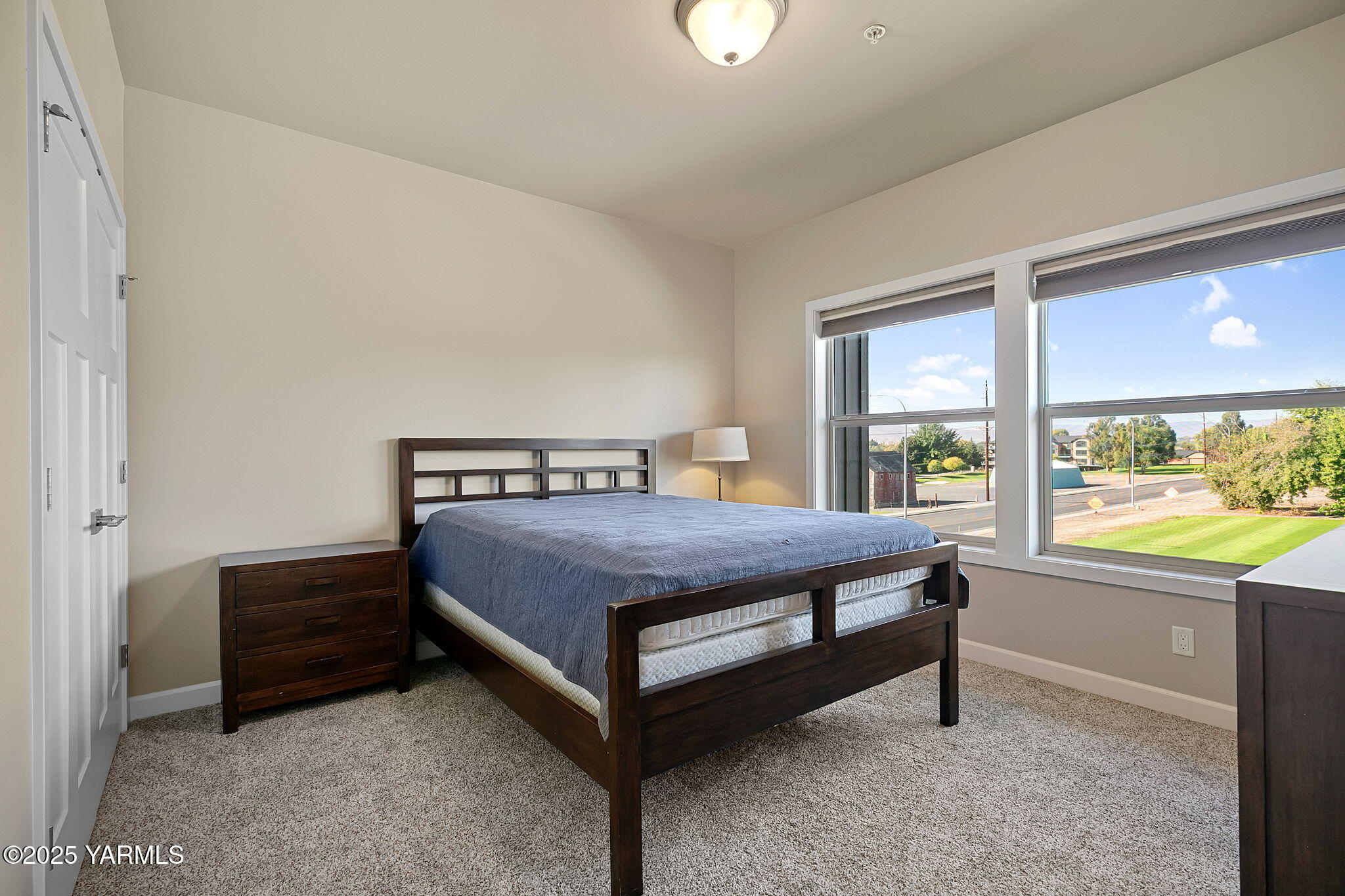 8905 Occidental Road, Unit 301A Yakima, WA 98903 - Photo 23 of 24 a bedroom with a bed and window