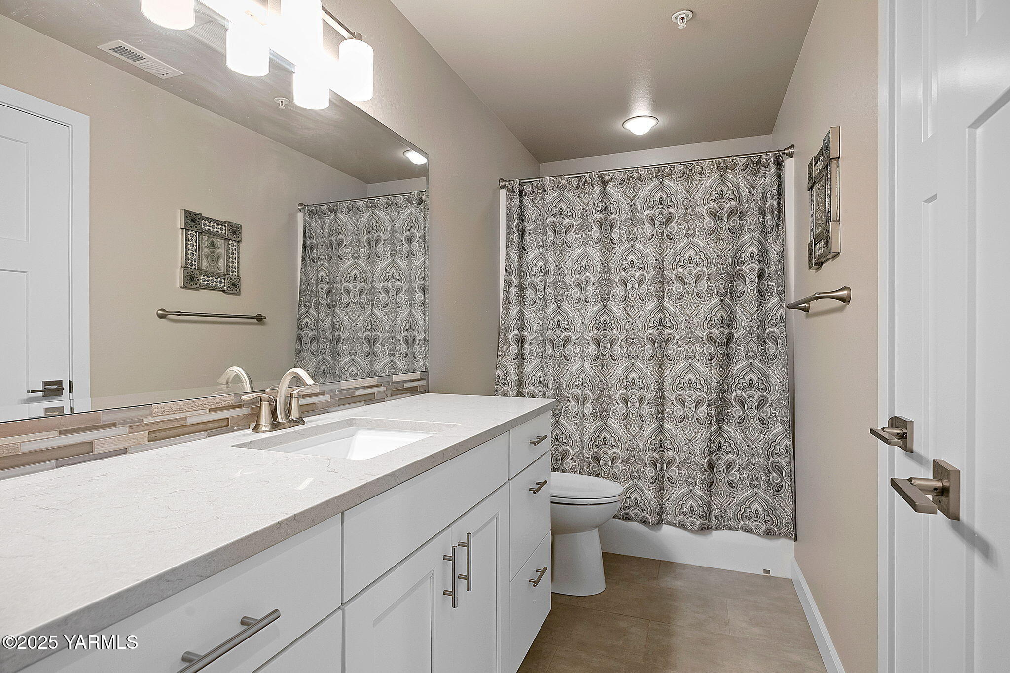 8905 Occidental Road, Unit 301A Yakima, WA 98903 - Photo 24 of 24 a bathroom with a double vanity sink toilet and shower