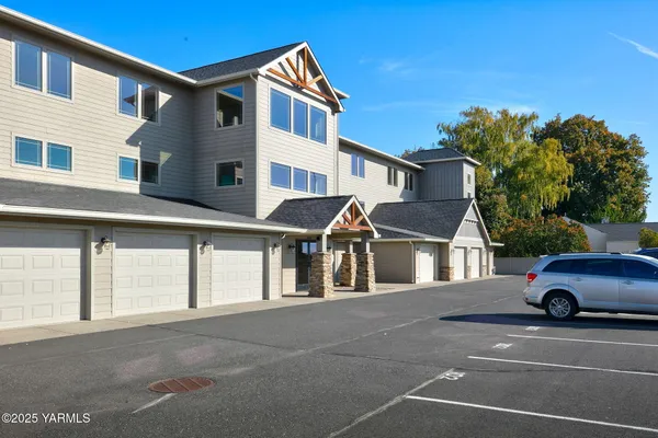 a front view of a house with a parking lot of a house