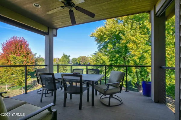 a balcony view with a outdoor seating space