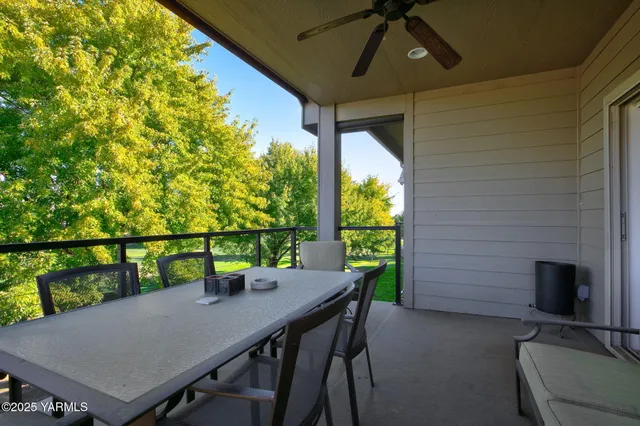 a view of a patio with a table chairs and a table