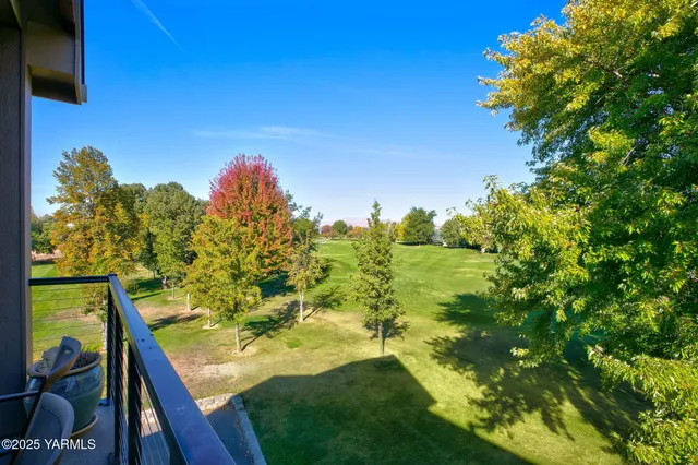 a view of a yard with an outdoor seating