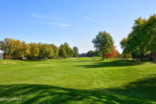 a view of a golf course with a lake