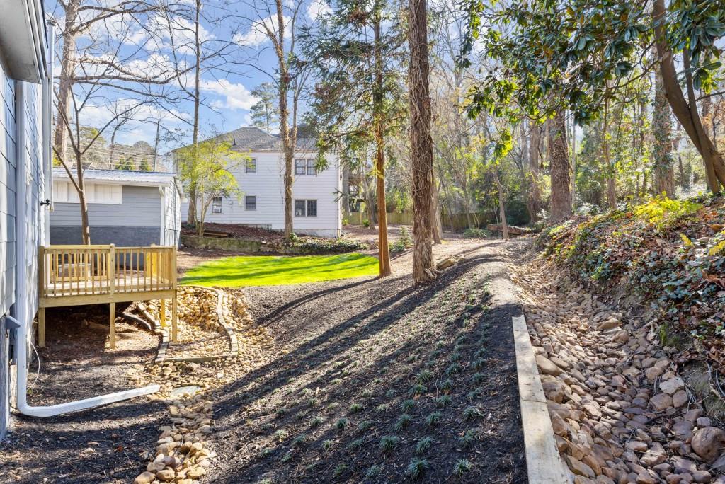 3310 East Roxboro Road Northeast Atlanta, GA 30324 - Photo 17 of 47 a view of a swimming pool with a yard