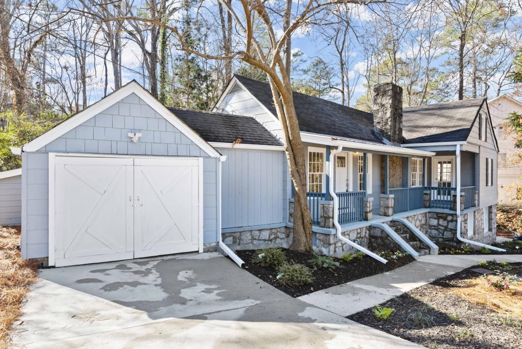 3310 East Roxboro Road Northeast Atlanta, GA 30324 - Photo 20 of 47 a front view of a house with garden