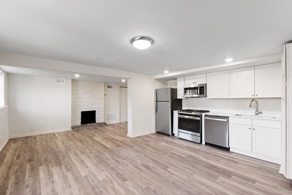 3310 East Roxboro Road Northeast Atlanta, GA 30324 - Photo 21 of 47 a large kitchen with cabinets and stainless steel appliances