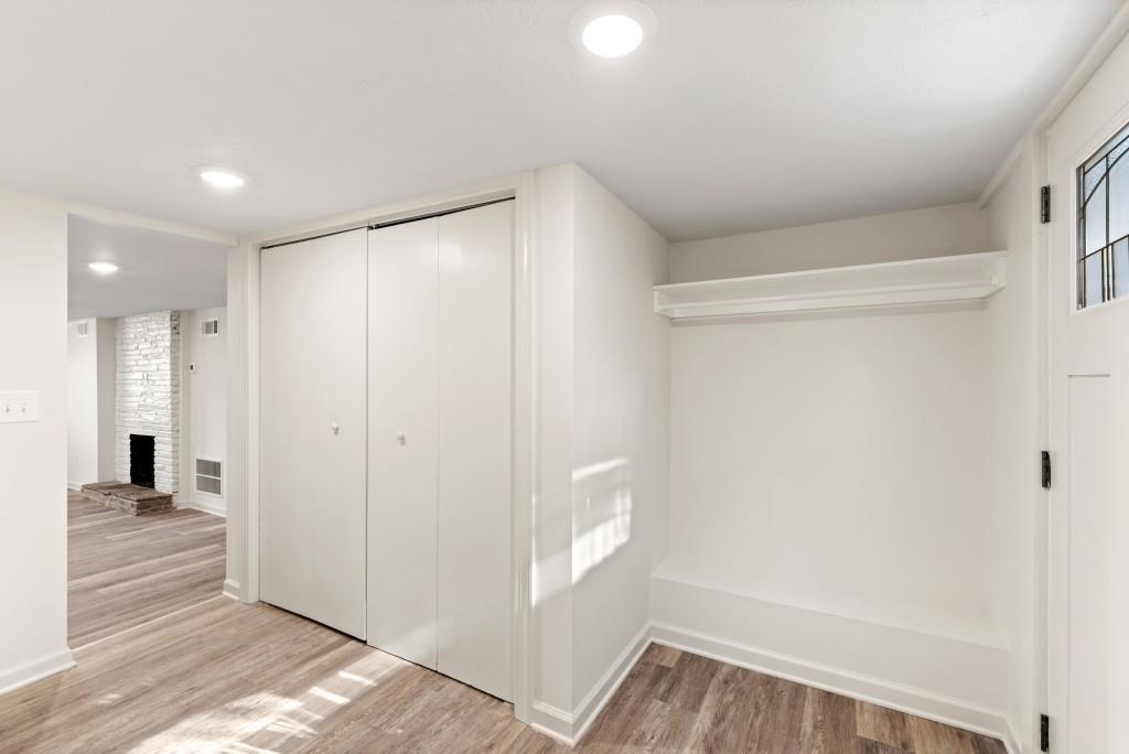 3310 East Roxboro Road Northeast Atlanta, GA 30324 - Photo 28 of 47 a view of a hallway with wooden floor and a bathroom