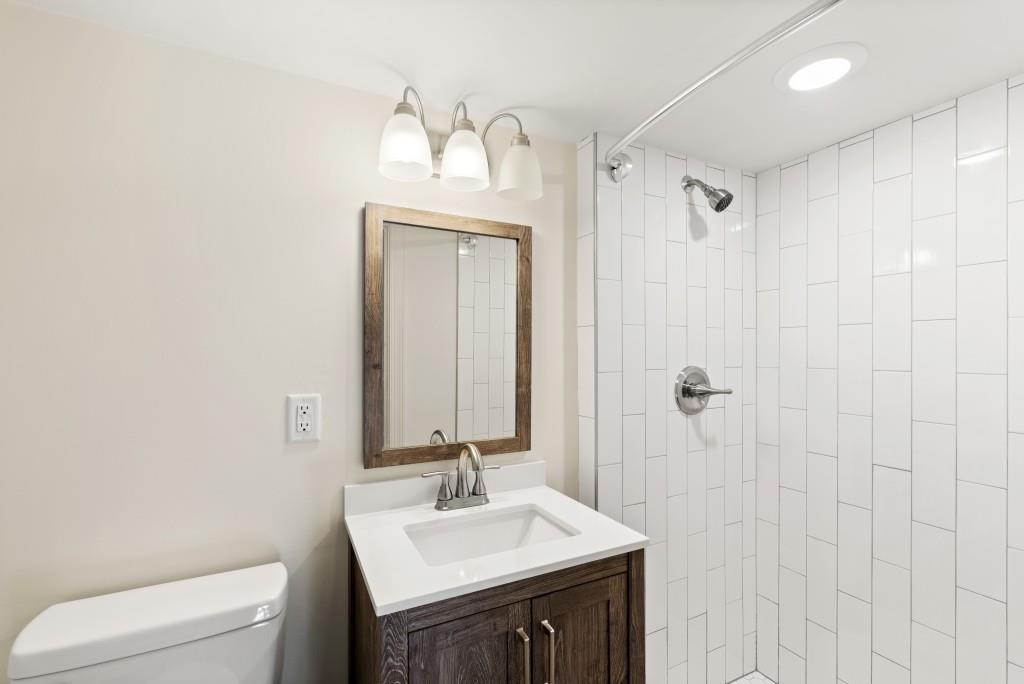 3310 East Roxboro Road Northeast Atlanta, GA 30324 - Photo 33 of 47 a bathroom with a sink vanity mirror and toilet