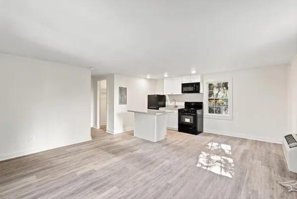 a kitchen with a stove and a microwave