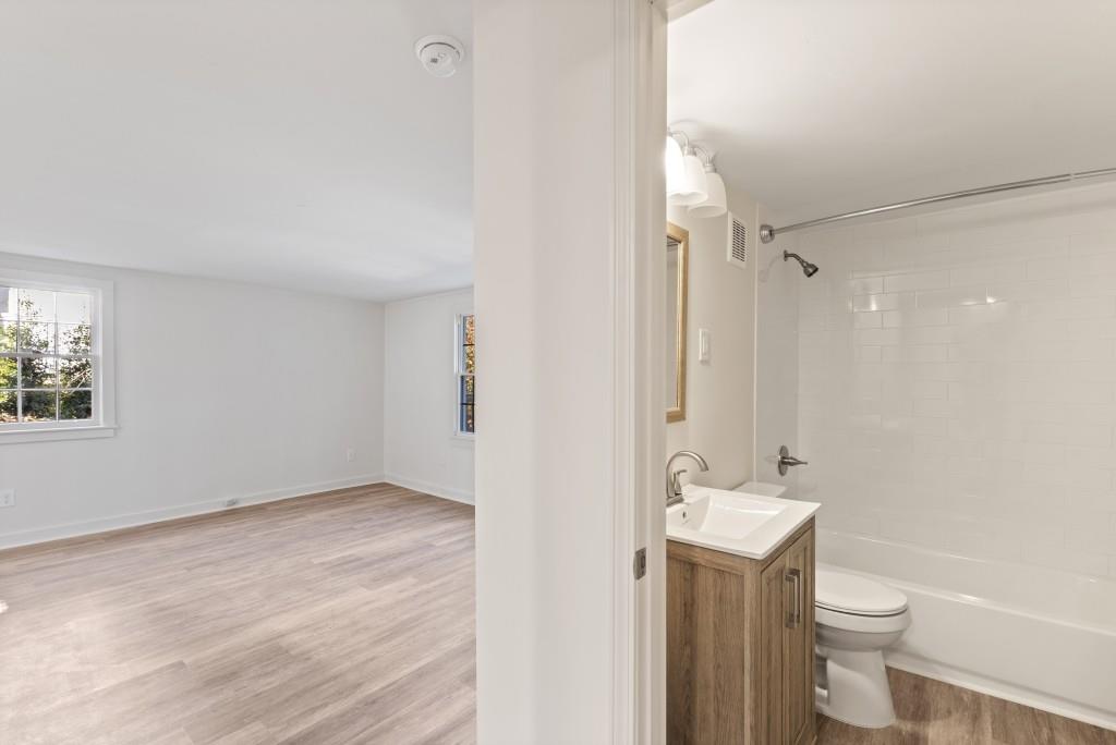 3310 East Roxboro Road Northeast Atlanta, GA 30324 - Photo 44 of 47 a bathroom with a sink a toilet and shower