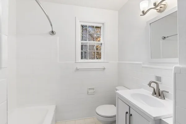 a bathroom with a sink toilet and vanity