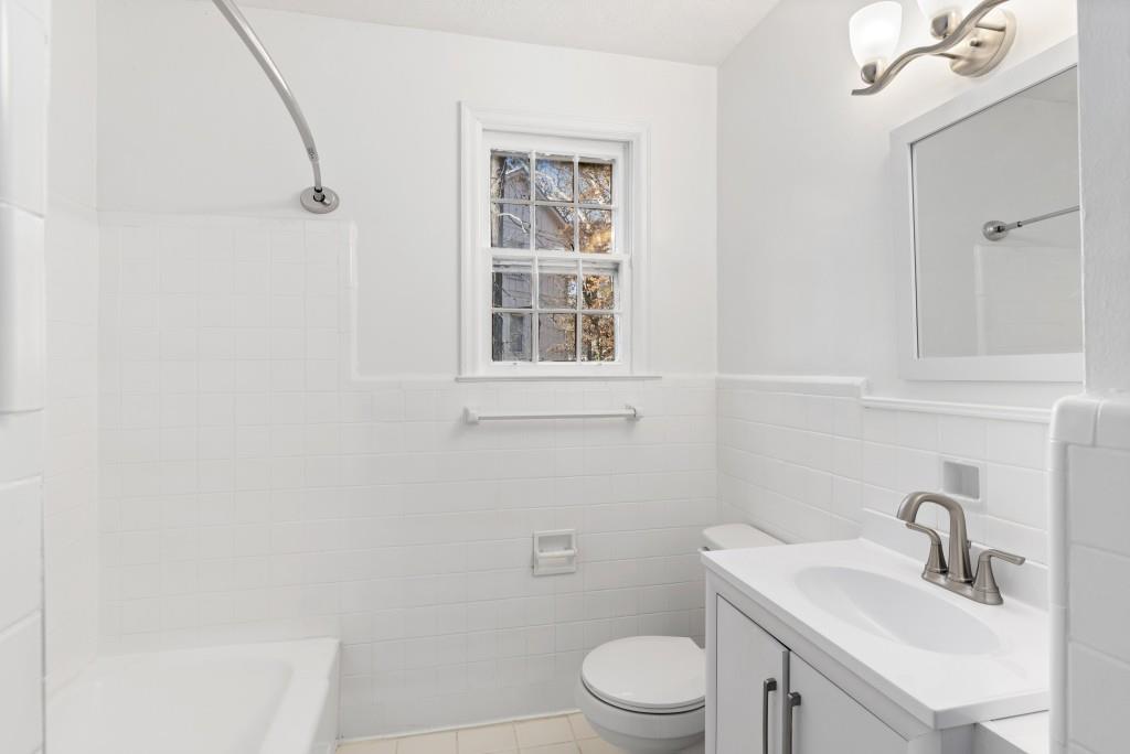 3310 East Roxboro Road Northeast Atlanta, GA 30324 - Photo 8 of 47 a bathroom with a sink toilet and vanity