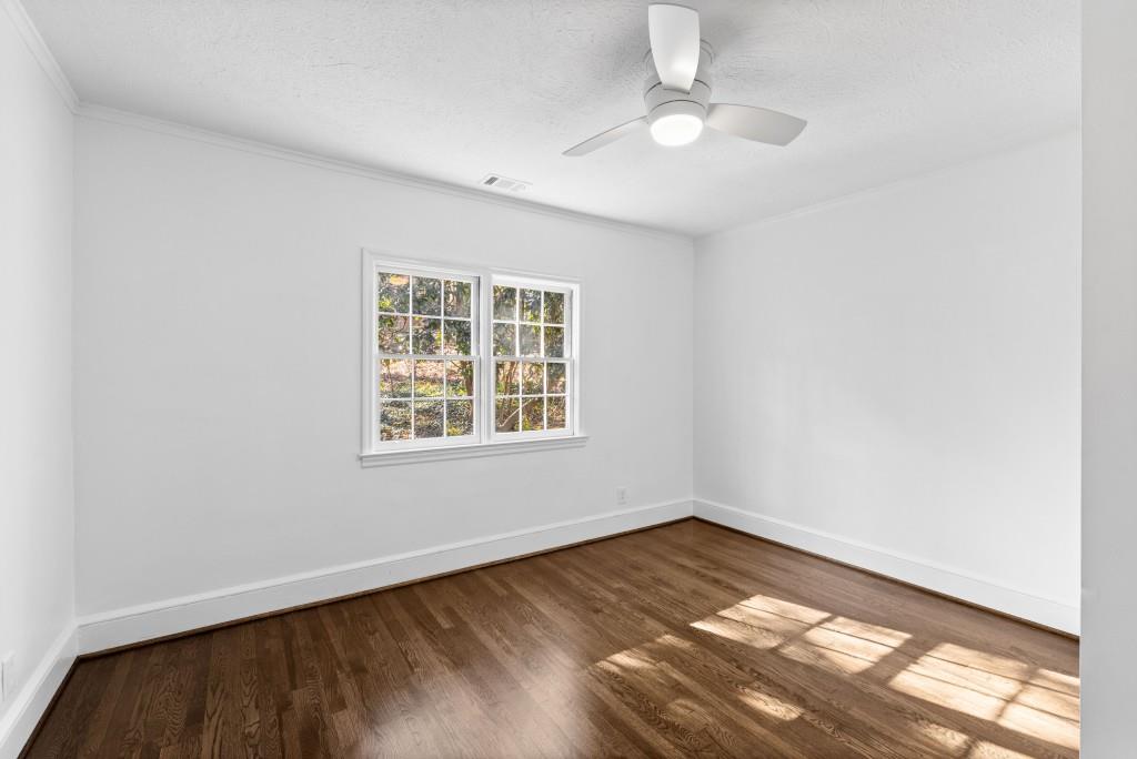 3310 East Roxboro Road Northeast Atlanta, GA 30324 - Photo 9 of 47 an empty room with a window