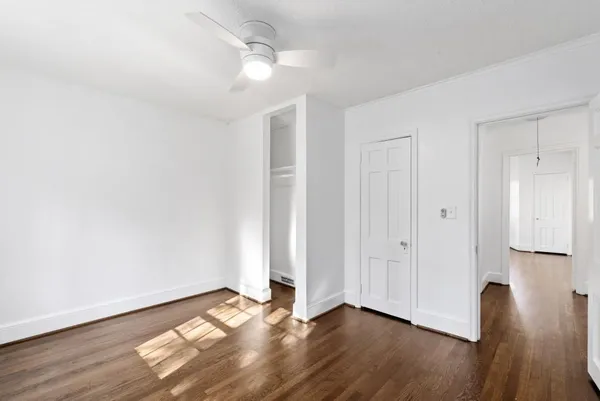 an empty room with wooden floor
