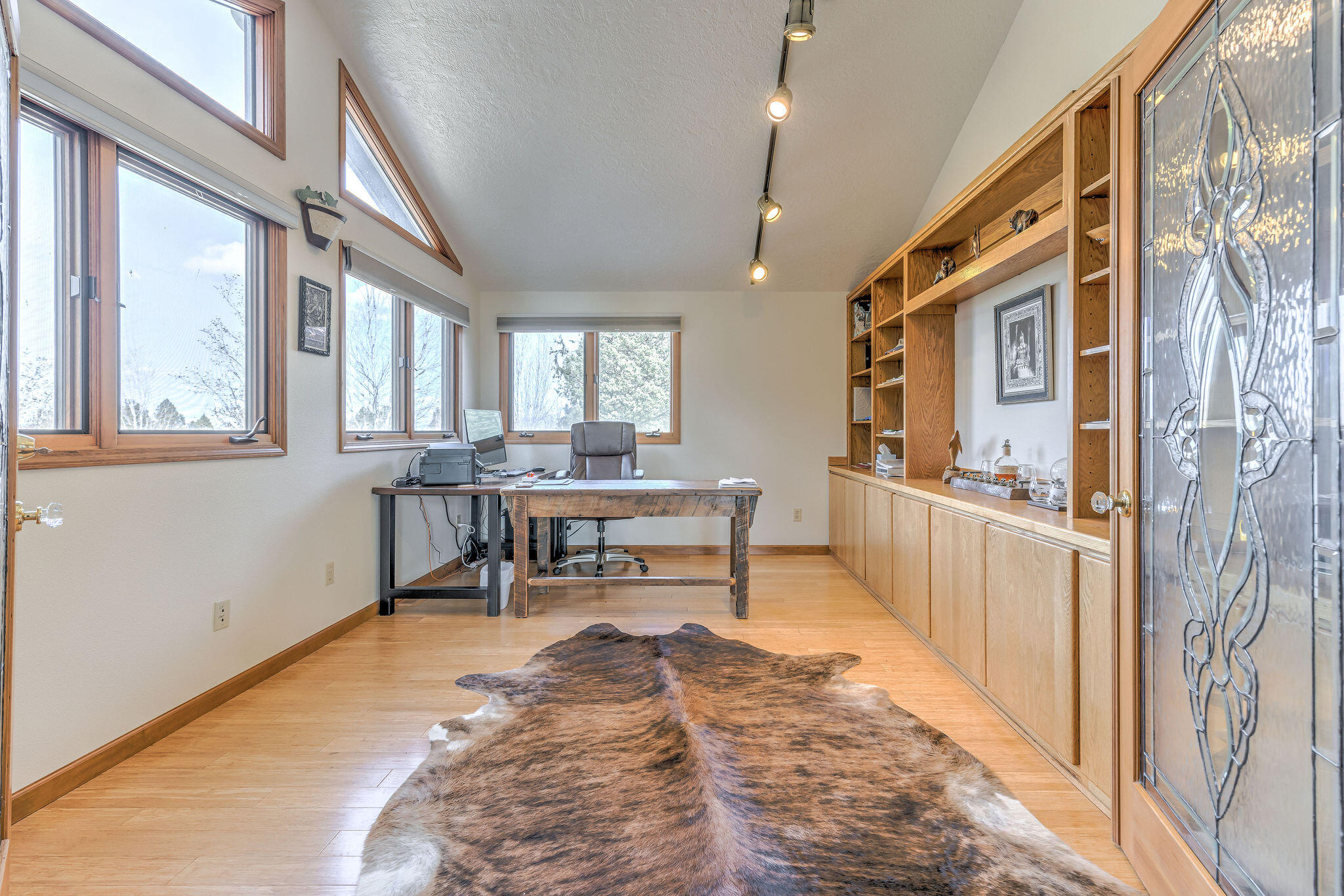 60975 Billadeau Road Bend, OR 97702 - Photo 27 of 65 a view of a livingroom with furniture window and wooden floor