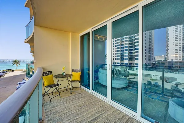 a view of a balcony with chairs