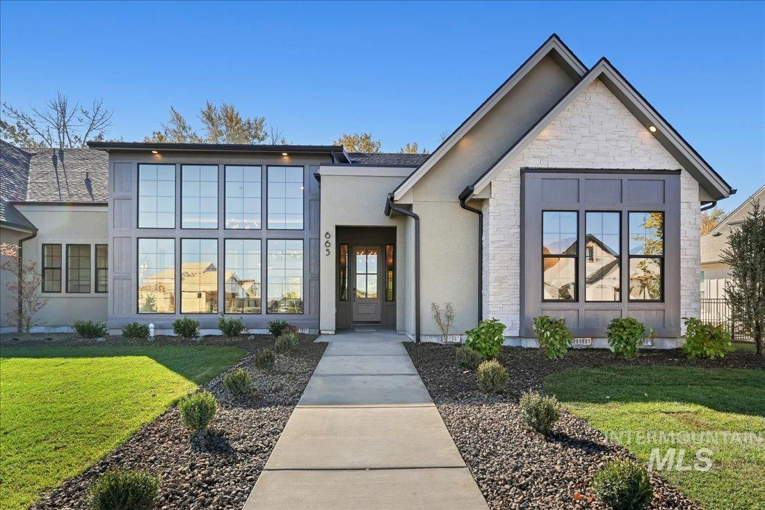 665 Watkins Street Middleton, ID 83644 - Photo 2 of 34 View of front of home with a front lawn, stone siding, and stucco siding