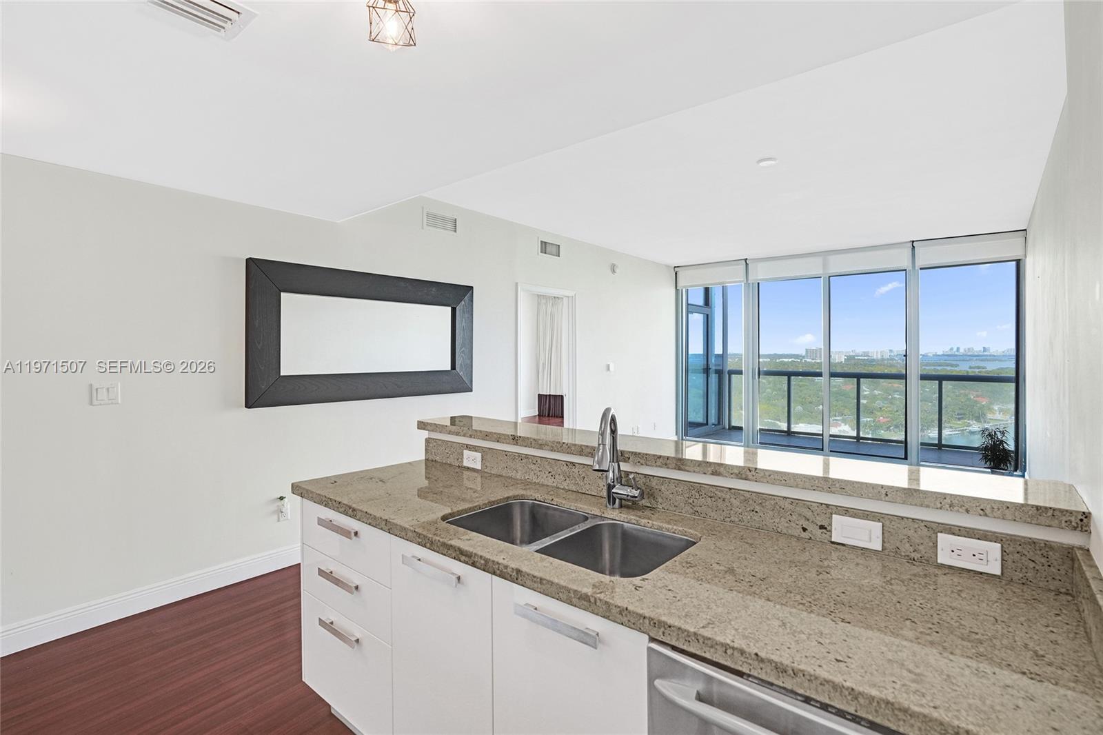 601 Northeast 36th Street, Unit 1908 Miami, FL 33137 - Photo 20 of 57 a kitchen with a sink and a window