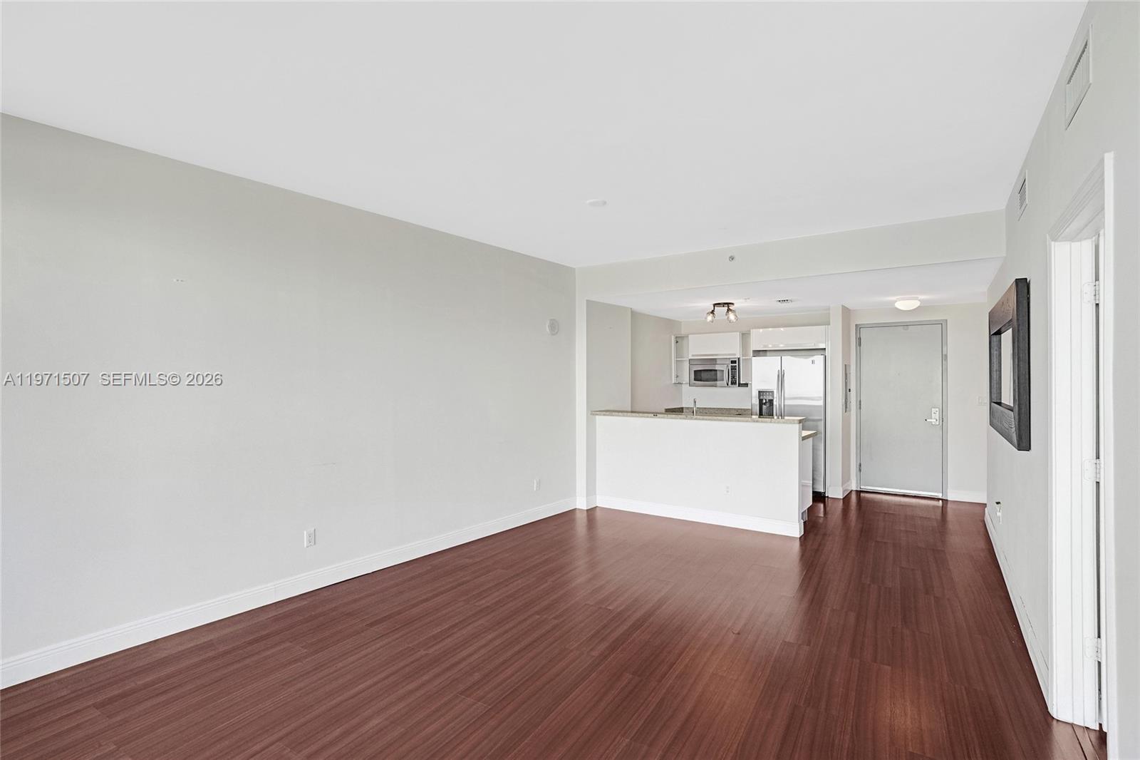 601 Northeast 36th Street, Unit 1908 Miami, FL 33137 - Photo 24 of 57 a view of a kitchen with wooden floor and a sink