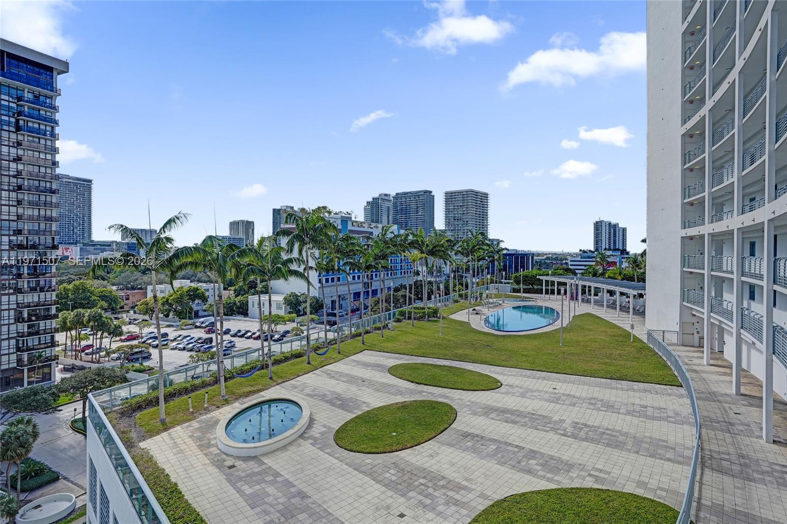 601 Northeast 36th Street, Unit 1908 Miami, FL 33137 - Photo 40 of 57 a view of a swimming pool with chairs