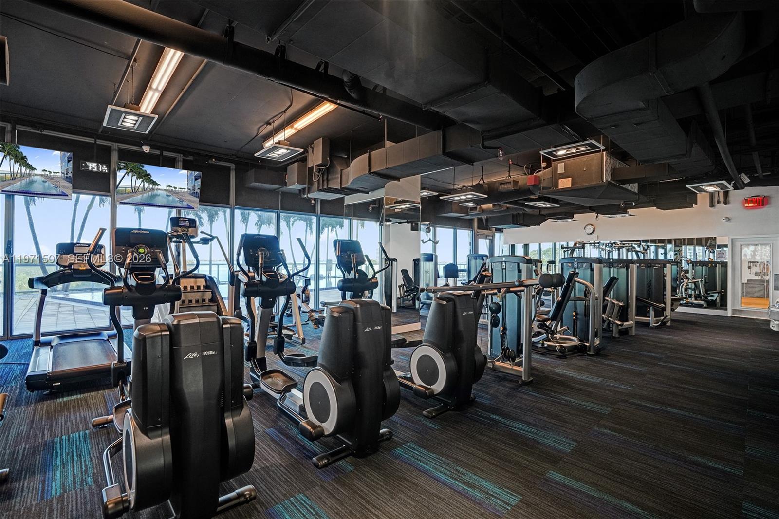 601 Northeast 36th Street, Unit 1908 Miami, FL 33137 - Photo 42 of 57 a view of a room with gym equipment