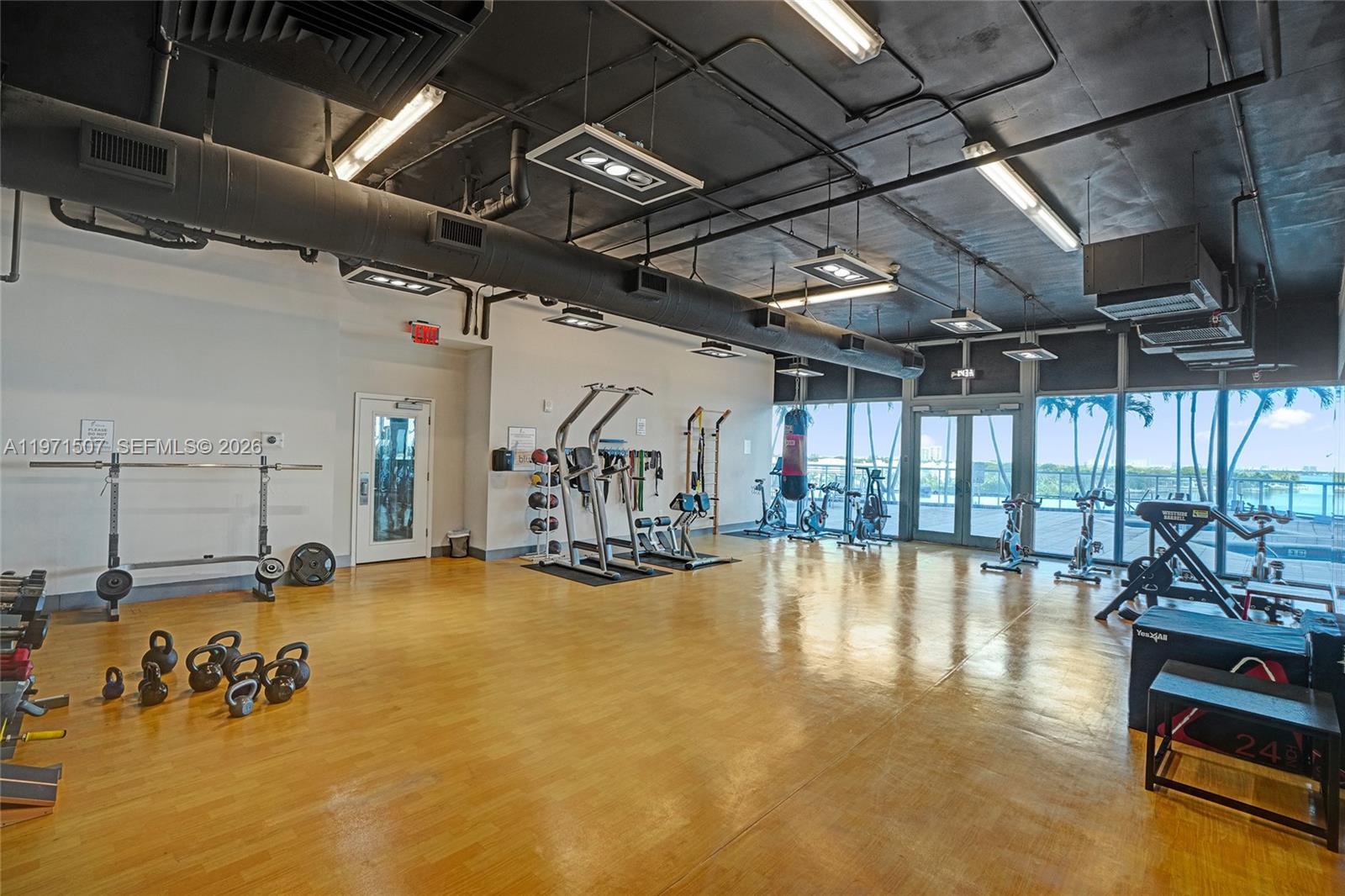 601 Northeast 36th Street, Unit 1908 Miami, FL 33137 - Photo 43 of 57 a view of a room with gym equipment