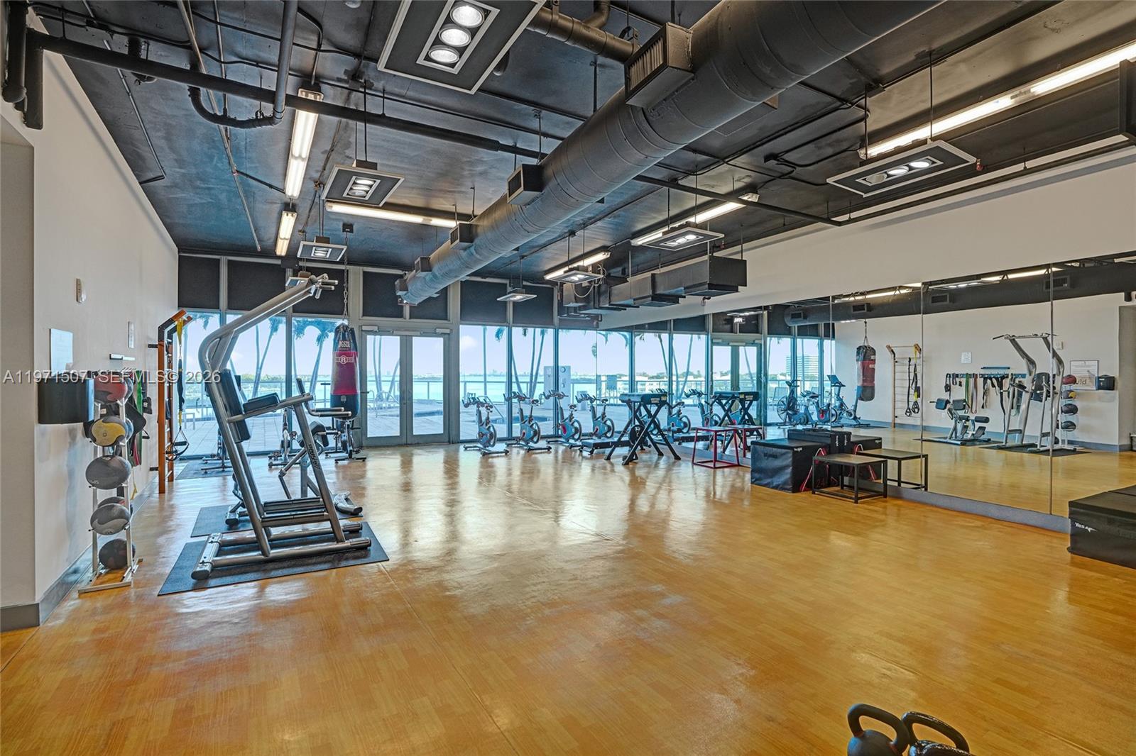 601 Northeast 36th Street, Unit 1908 Miami, FL 33137 - Photo 44 of 57 a view of a room with gym equipment