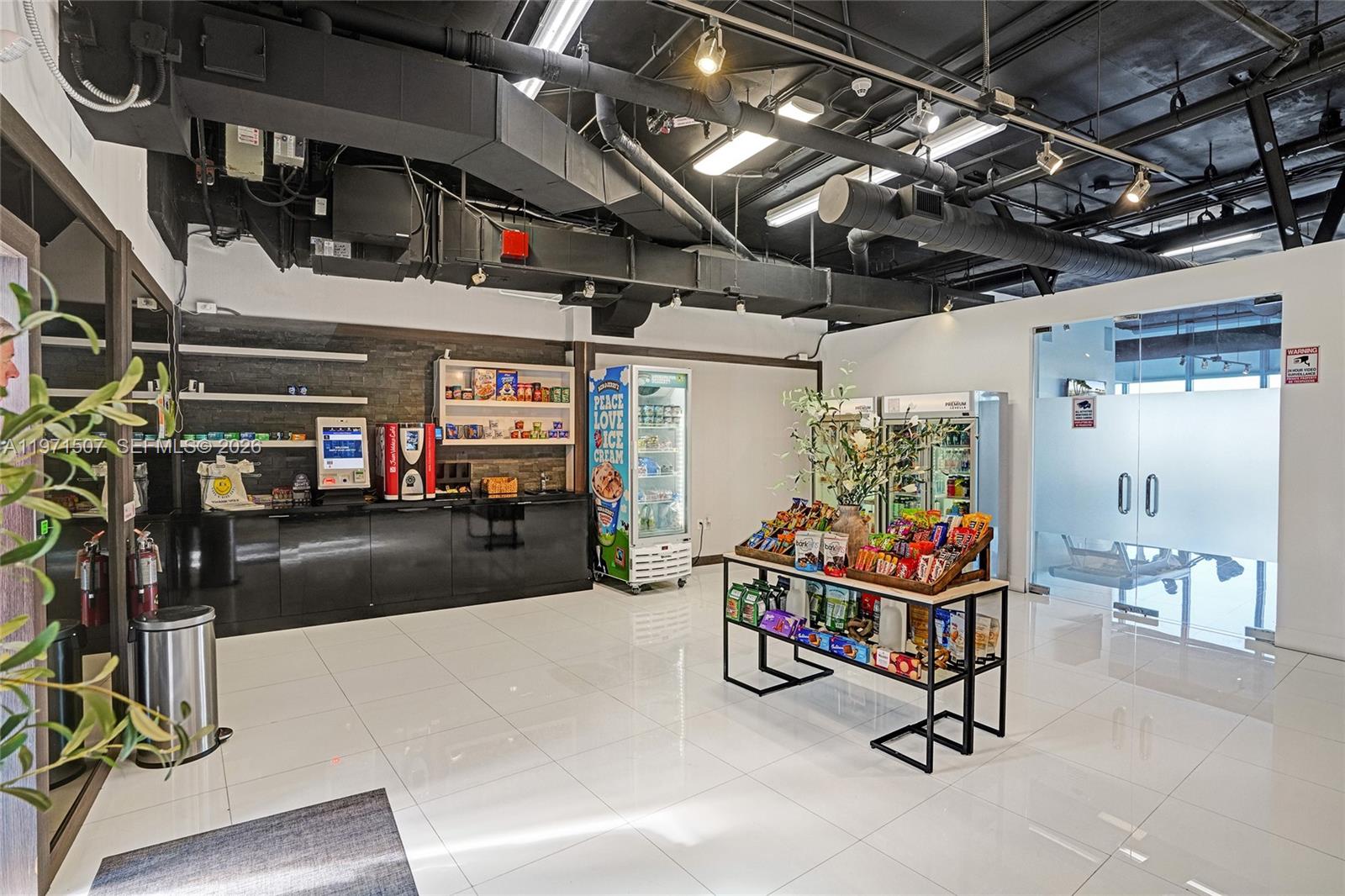 601 Northeast 36th Street, Unit 1908 Miami, FL 33137 - Photo 52 of 57 a view of a room with gym equipment