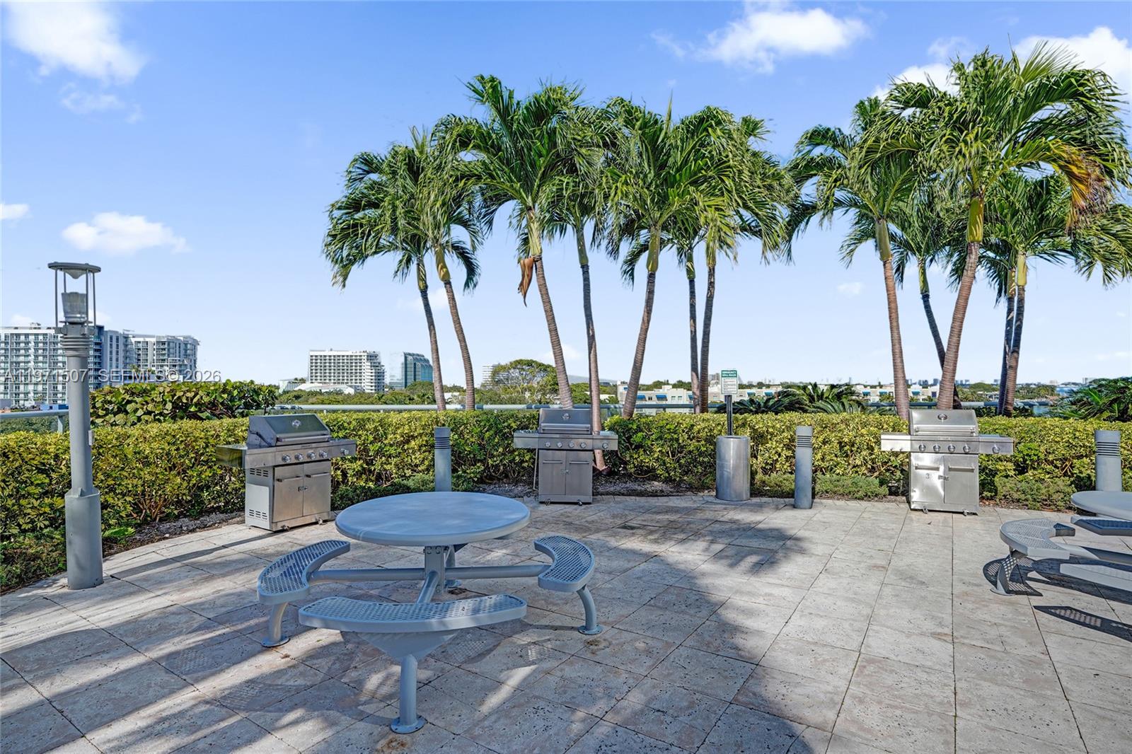 601 Northeast 36th Street, Unit 1908 Miami, FL 33137 - Photo 56 of 57 a view of a backyard with plants and swimming pool