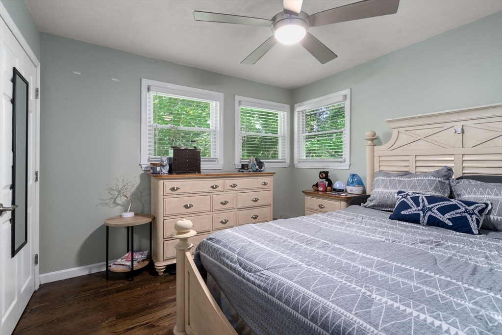 5 Flint Road Tyngsboro, MA 01879 - Photo 20 of 31 a bedroom with a bed a large window and furniture