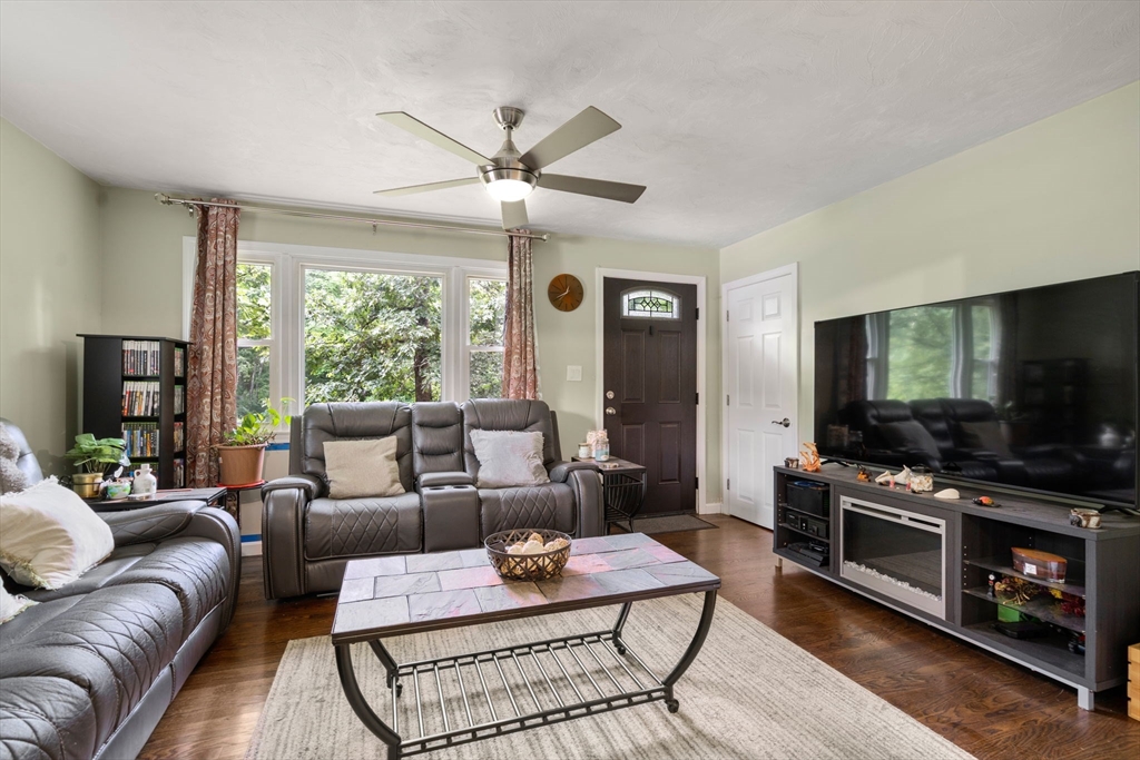 5 Flint Road Tyngsboro, MA 01879 - Photo 6 of 31 a living room with furniture and a flat screen tv
