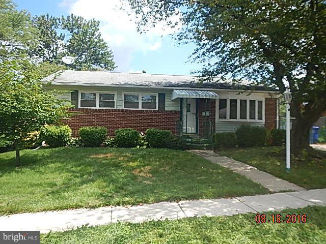 12907 Holdridge Road Silver Spring, MD 20906 - Photo 1 of 14 front view of a house with a yard