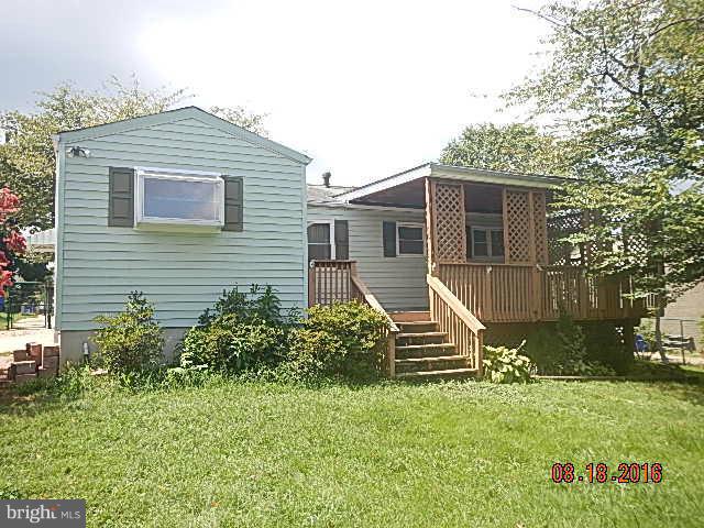 12907 Holdridge Road Silver Spring, MD 20906 - Photo 3 of 14 a front view of a house with a yard