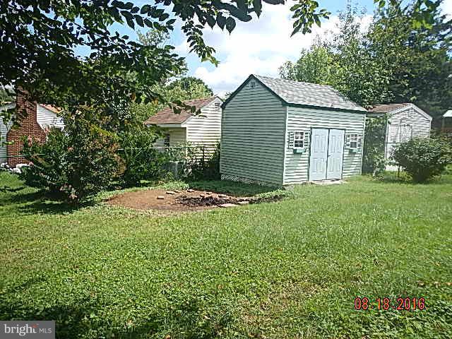 12907 Holdridge Road Silver Spring, MD 20906 - Photo 6 of 14 a view of a house with yard and a garden