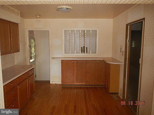 12907 Holdridge Road Silver Spring, MD 20906 - Photo 7 of 14 wooden floor in an empty room