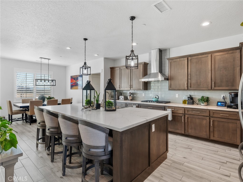 22427 Huasna Road Apple Valley, CA 92307 - Photo 11 of 39 a kitchen with sink cabinets and wooden floor