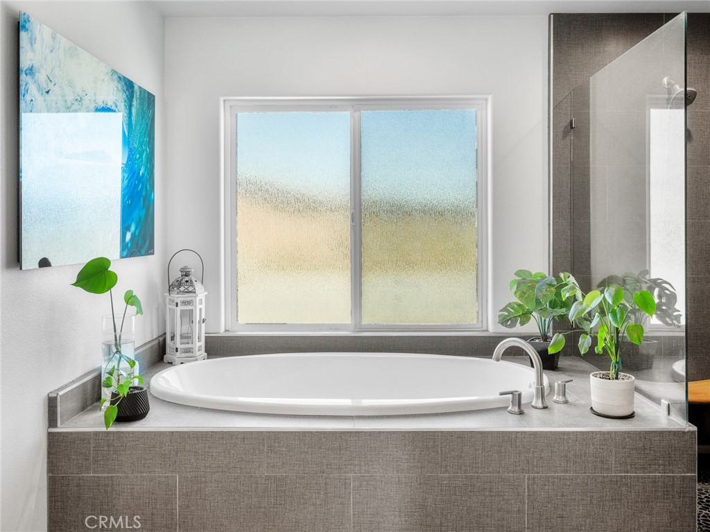 22427 Huasna Road Apple Valley, CA 92307 - Photo 22 of 39 a white bath tub with a shower