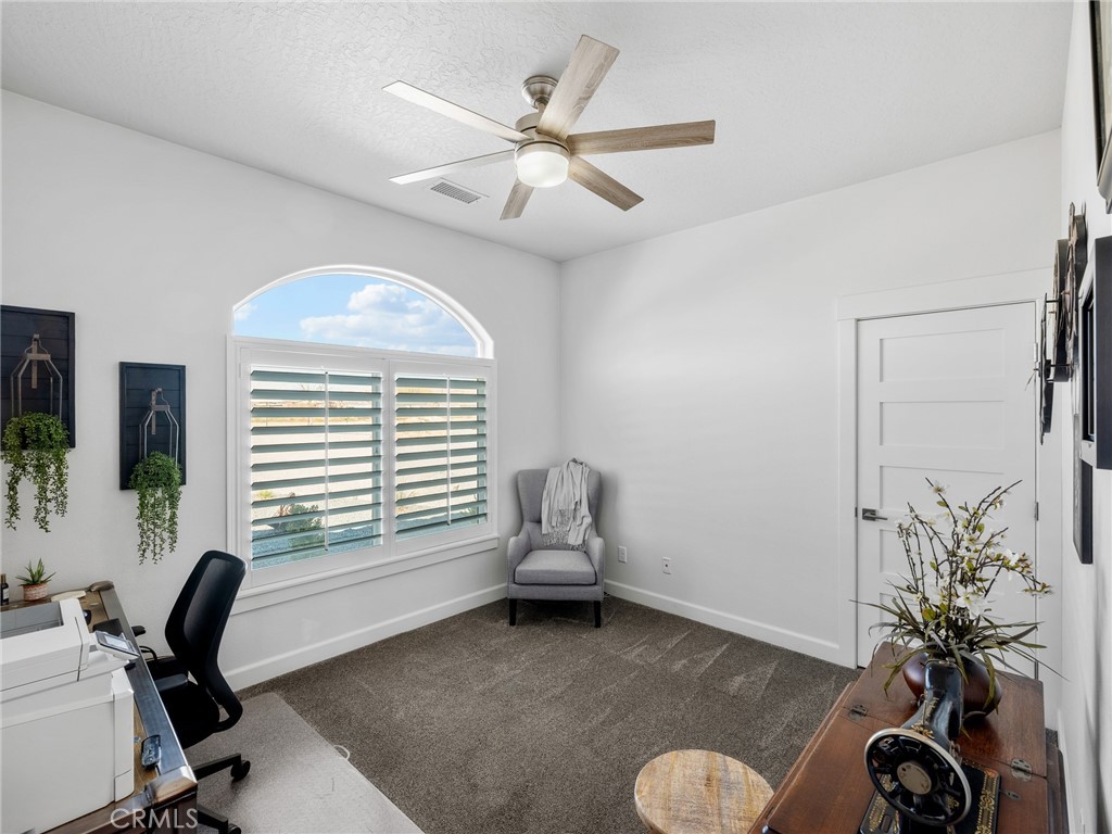 22427 Huasna Road Apple Valley, CA 92307 - Photo 25 of 39 a workspace with furniture and a window