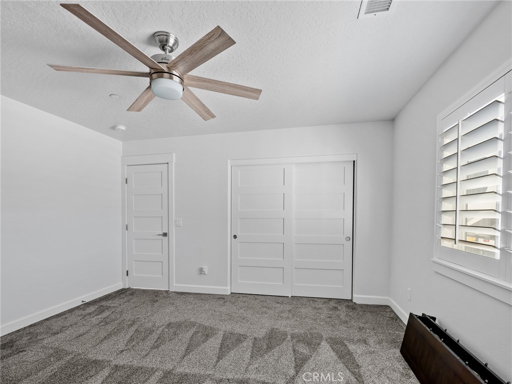 22427 Huasna Road Apple Valley, CA 92307 - Photo 26 of 39 a view of an empty room with a window