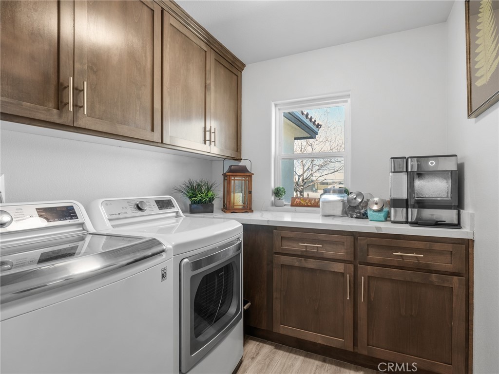22427 Huasna Road Apple Valley, CA 92307 - Photo 27 of 39 a kitchen with cabinets a sink and appliances