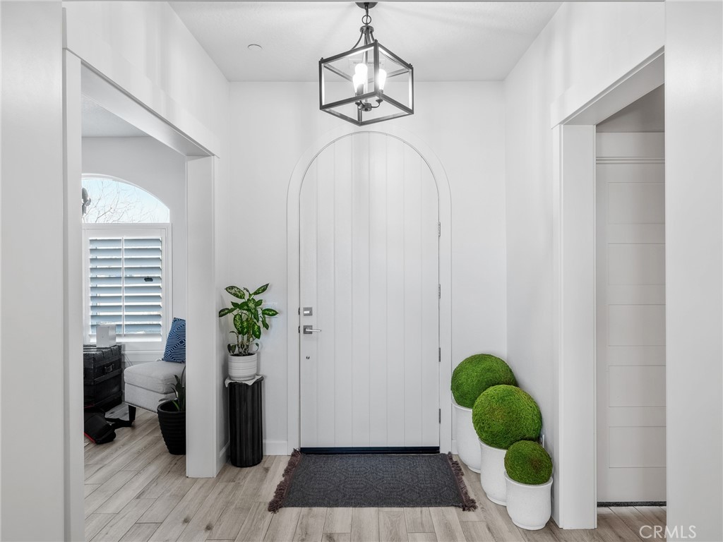 22427 Huasna Road Apple Valley, CA 92307 - Photo 4 of 39 a bathroom with a potted plant on the counter and a window